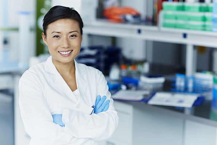 Portrait of confident female scientist in modern laboratory