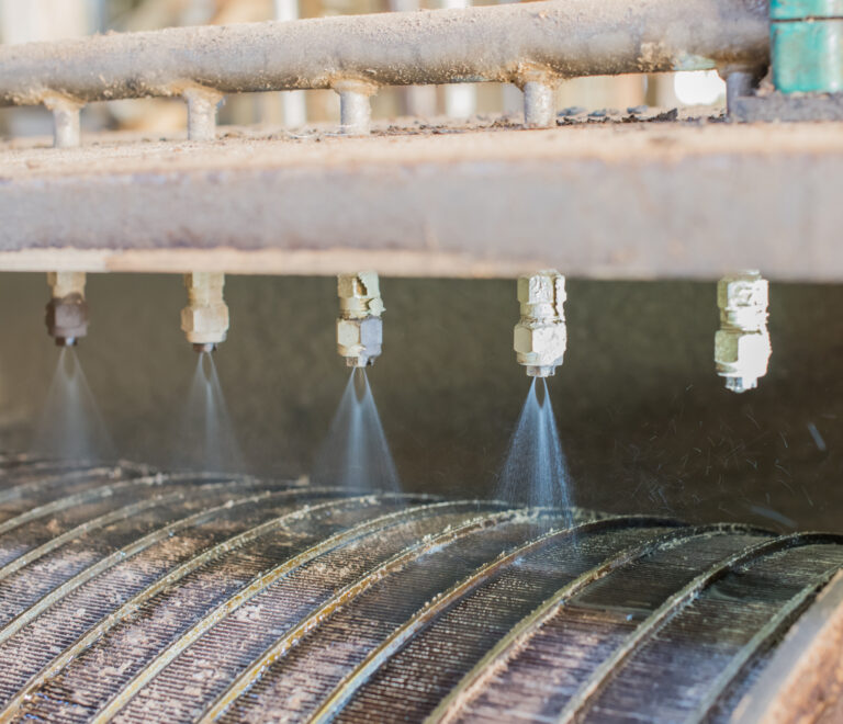 The injectors spray water on the contaminated drum