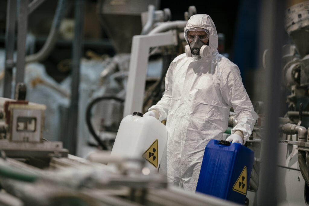 Factory worker working with dangerous materials